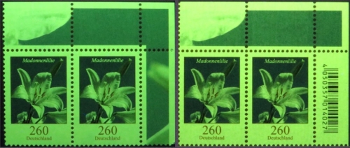 Vergleich Erstaufalge und Nachauflage 260 Cent Madonnenlilie unter UV-Licht 365 Nanometer – rechts die Nachauflage leuchtet etwas heller Vergleich Erstaufalge und Nachauflage 260 Cent Madonnenlilie unter UV-Licht 365 Nanometer – rechts die Nachauflage leuchtet etwas heller